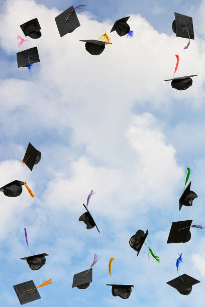 istock Graduation caps thrown in the sky 2199042431