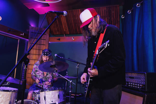 istock Rock guitarist and drummer have a jam session 2199042463