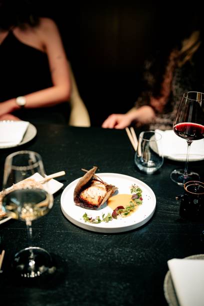 istock Elegant dining with gourmet dish and wine. 2199042550