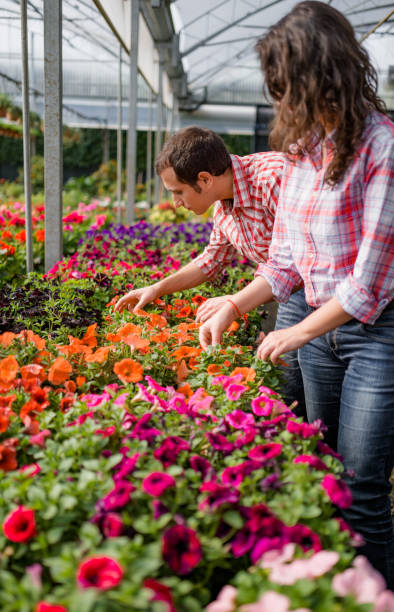 istock taking care of the flowers 2199042617
