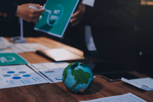 istock Carbon offset price report CO2 emission. Future growth Net zero waste in ESG ethical SME office protect climate change global warming social issues project. Group of asia people Eco friendly SDGs plan 2199045953