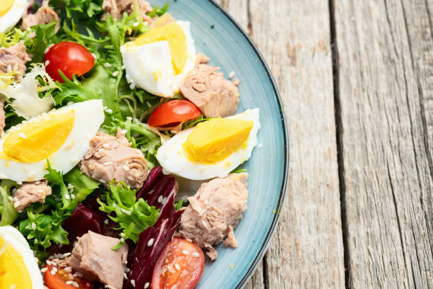 istock Canned Tuna salad with eggs and tomatoes photography . Top view 2199047106