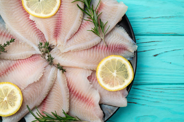 istock Raw tilapia fillet photography . Top view 2199047125
