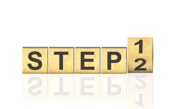 istock Flipping wooden cubes block for changing step 1 to step 2 on white background 2199051253