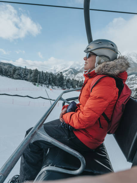 istock Woman on a ski lift 2199051450