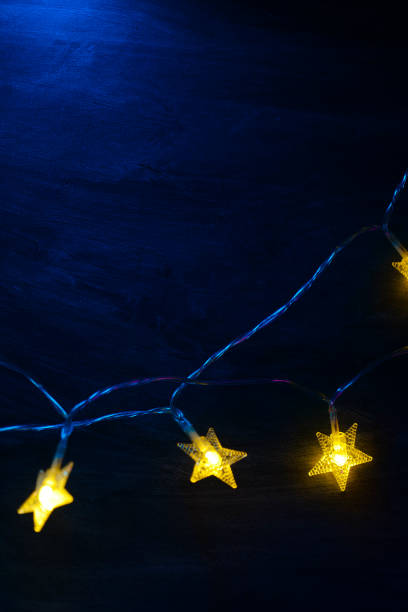 istock Christmas wallpaper With Yellow stars on a blue background.space for text. 2199051911