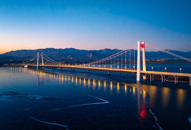 A bridge captured by a drone over the night sky