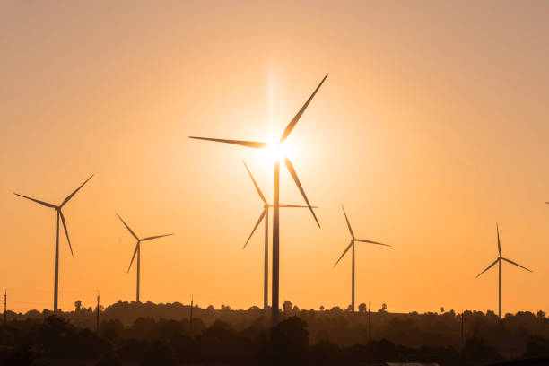 istock View of wind turbine against sunset sky 2199052372