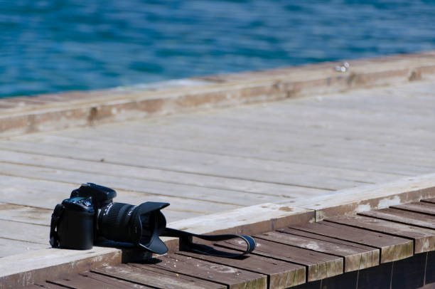 istock A camera placed on a pier at the lake. 2199052556