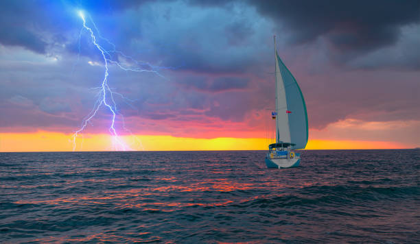 istock Sailing yacht in a stormy weather with thunder and lightning 2199052593