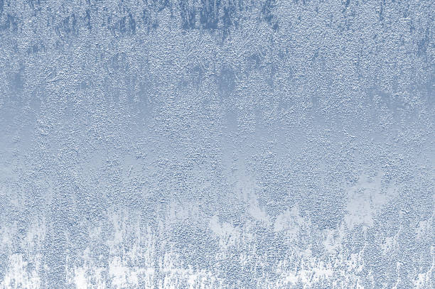 Background texture of the snow-covered ice surface close-up view from above