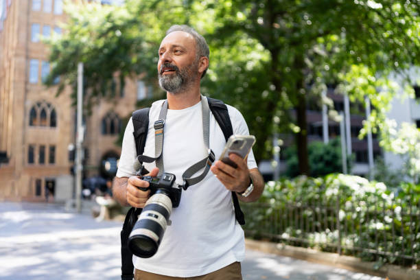 istock Man with Professional Camera Exploring Urban Outdoor Settings 2199053464