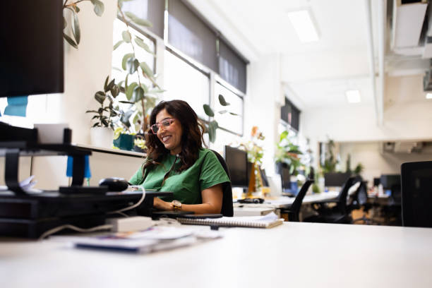 istock Professional Woman Relaxing at Work in Modern Office Environment 2199056906