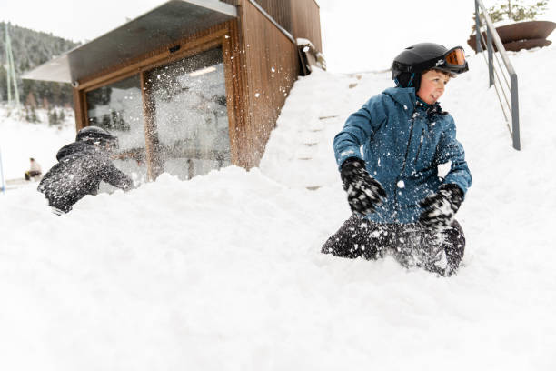 istock Children enjoying snowball fight 2199059239