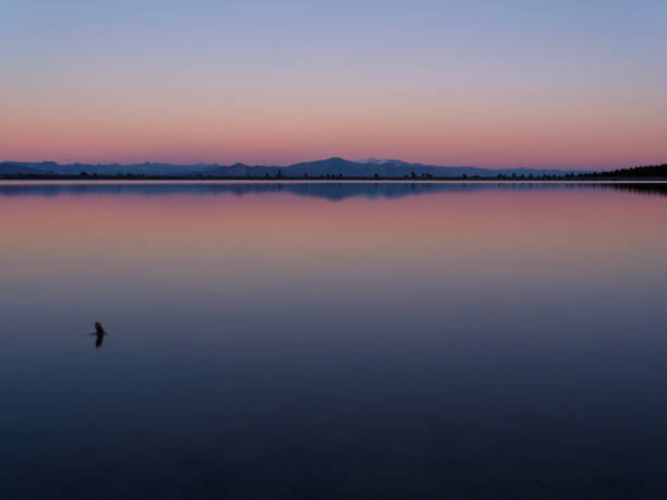 istock Mountains reflecting on the lake during the golden hour at sunset. 2199059306