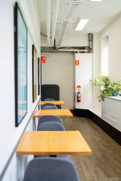 istock Bright and Modern Interior Space with Wooden Tables and Minimalist Decor 2199059966