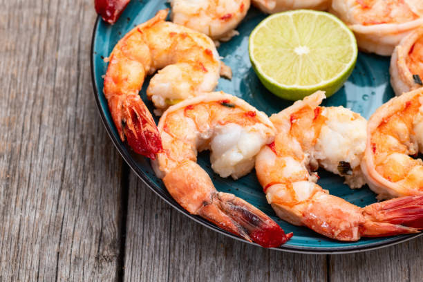 istock Grilled Tiger shrimps with lime photography . Top view 2199061218