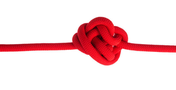 istock A red rope tied into a tension knot and pulled tight, showing stress and difficulty 2199062405