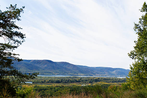 mountain landscape with blue sky. Autumn landscape with dense trees and vibrant foliage under a clear blue sky. from a bird's eye view. Scene of unspoiled nature.