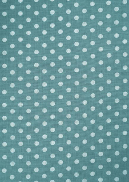 istock Green fabric with white polka dots in a vignette 2199066143