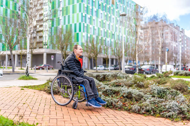 istock Young man with a disability in a wheelchair 2199066612