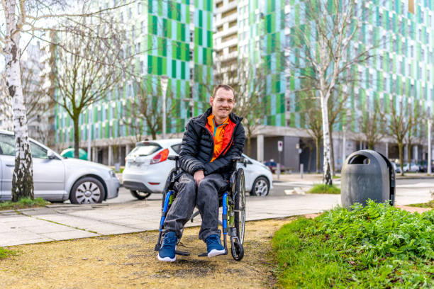 istock Young man with a disability in a wheelchair 2199066629
