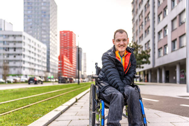 istock Young man with a disability in a wheelchair 2199066661