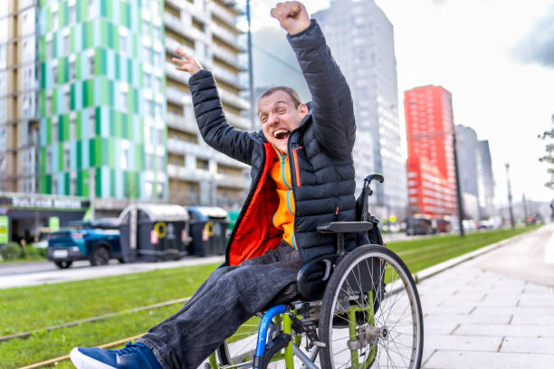istock Young man with a disability in a wheelchair 2199066737