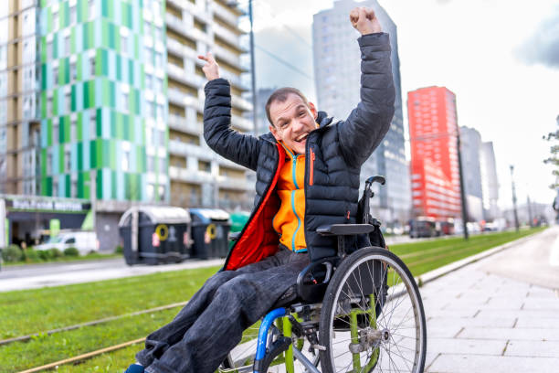 istock Young man with a disability in a wheelchair 2199066784
