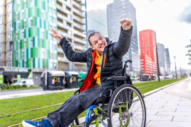 istock Young man with a disability in a wheelchair 2199066801