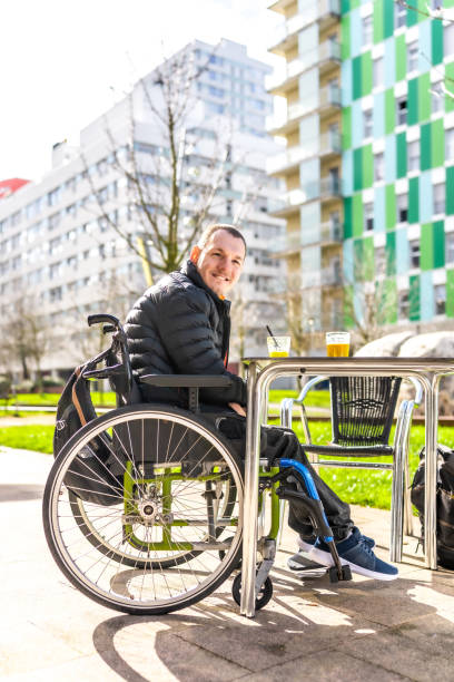 istock Young man with a disability in a wheelchair 2199067227