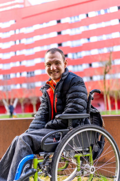 istock Young man with a disability in a wheelchair 2199067420