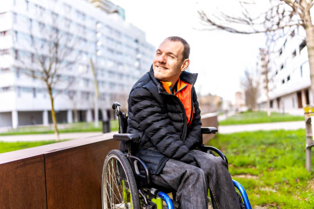 Young man with a disability in a wheelchair