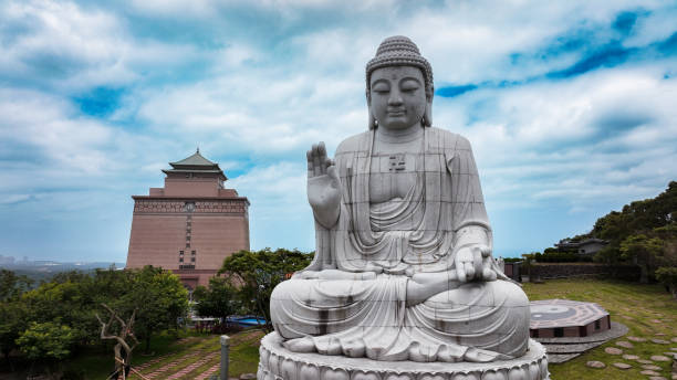 istock Large seated Buddha statue overlooking a serene landscape in a cemetery in Taiwan 2199067833