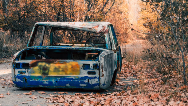 istock abandoned broken rusty car on Chernobyl street 2199074053