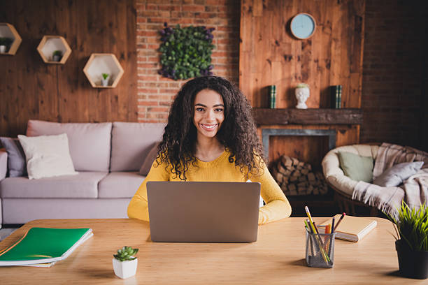 istock Young afro-american student studying remotely in a cozy home interior with natural daylight and modern furniture. 2199076217