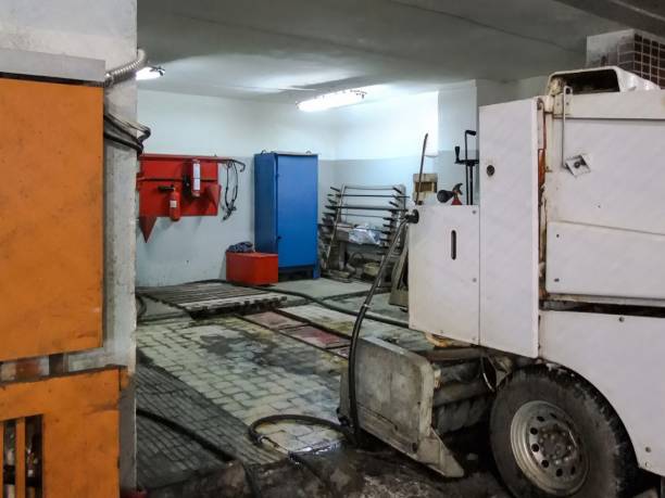 istock A white industrial machine stands in a factory setting with a blue cabinet and fire extinguisher in the background. 2199076453