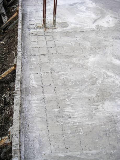 istock A new concrete slab under construction shows the early stages of curing on a construction site. 2199076491