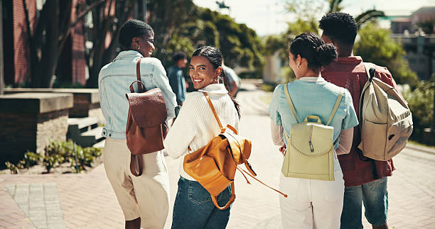 istock Development, education and walking with student friends outdoor together for learning or study at university. Back, college and portrait with learner group on campus for knowledge or scholarship 2199077245