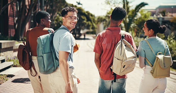 istock Education, smile and walking with student friends outdoor together for learning or study at university. College, future and portrait with happy learner group at school for knowledge or scholarship 2199077246
