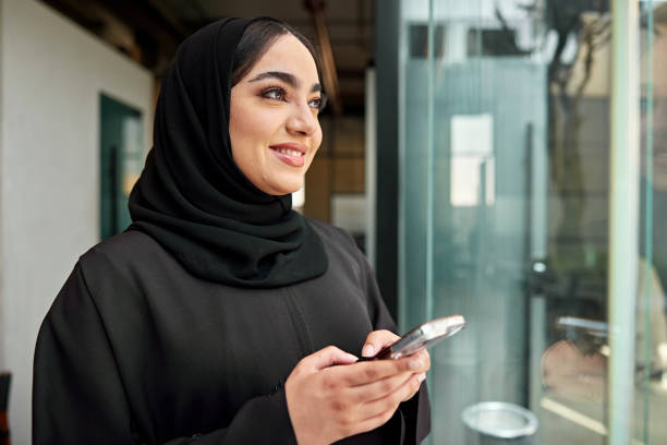 istock Saudi businesswoman getting good news while texting 2199080956