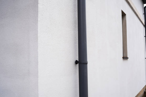 istock Side view of a modern building with a gray downspout and minimalistic design 2199081235