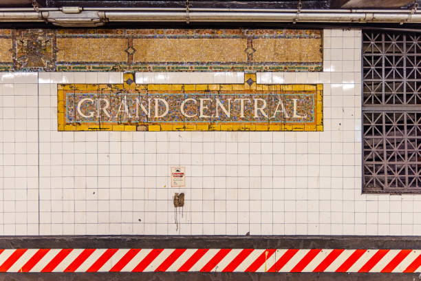 Grand Central Station terminal located in Midtown, Manhattan New York City, USA.  Many unrecognizable commuters rush through the busy subway train station. Blurred motion.  Public transportation. 
