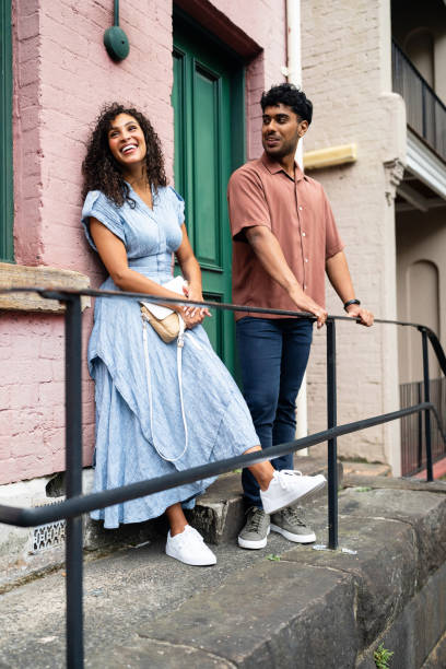 istock Casual Urban Interaction Between Smiling Young Adults in Outdoor Setting 2199086734