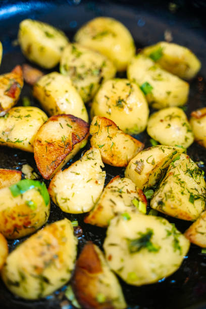 istock Roasted herb potatoes background. Fried potatoes country style 2199087894