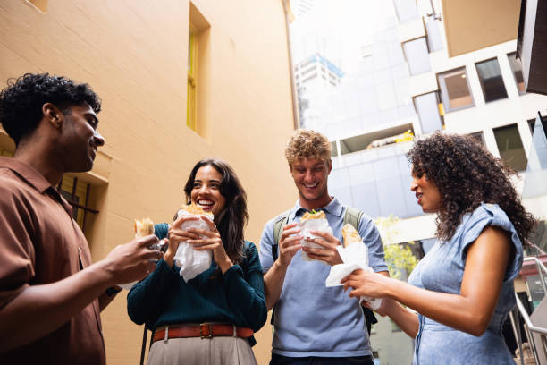 istock Friends Sharing a Meal Outdoors in a Modern Urban Setting 2199088674