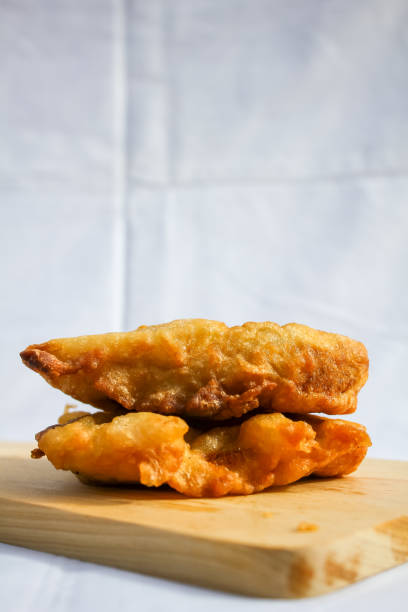 istock two hot fried bananas on a wooden board 2199090889