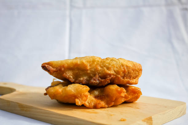 istock two hot fried bananas on a wooden board 2199090892