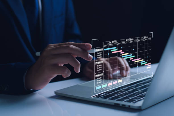 istock Project manager working on tablet. updating tasks and milestones progress planning with Gantt chart scheduling interface for company on virtual screen. Business 2nd quarter Project Management System 2199091281