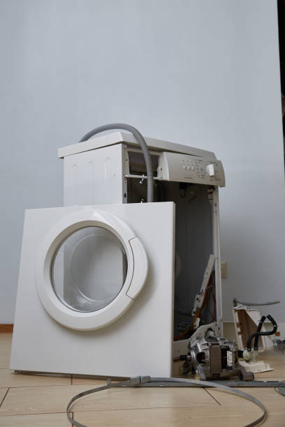 istock Washing machine repair. Disassembled washing machine. Close-up. Copy space. 2199092421